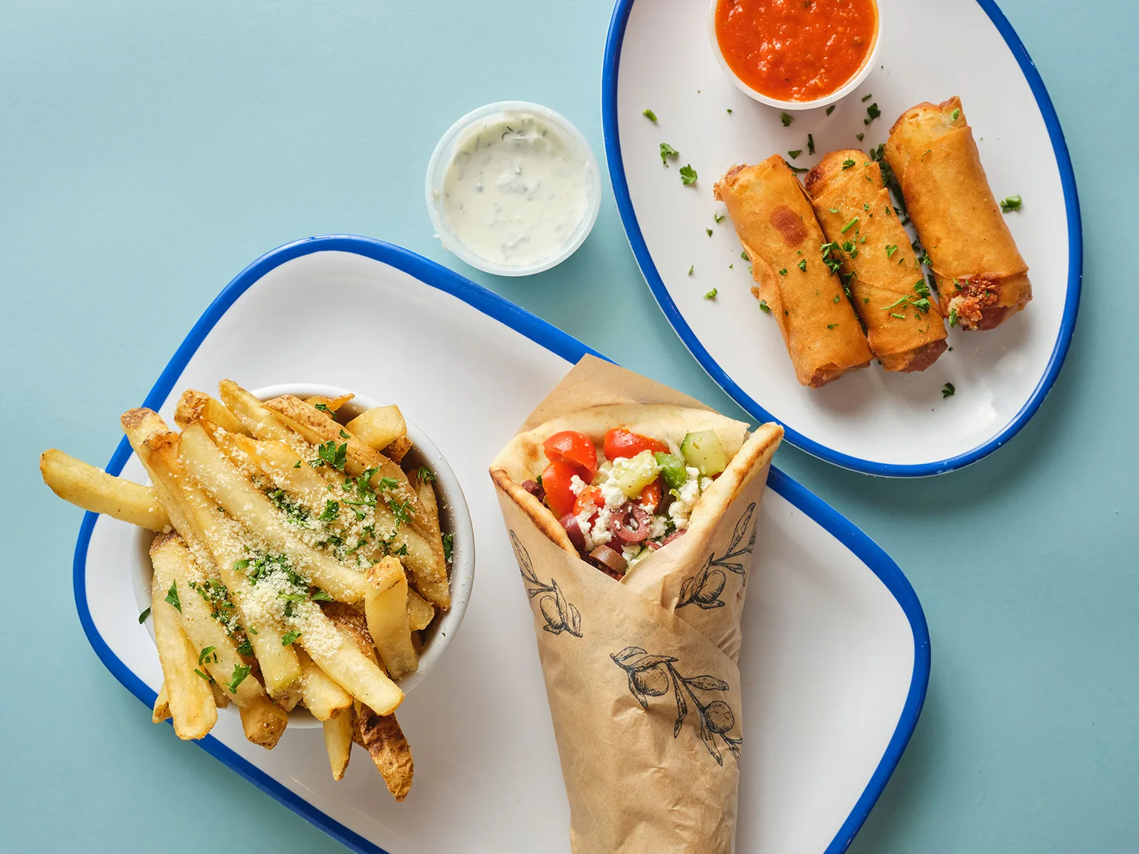 A spread of Aplós Mediterranean dishes